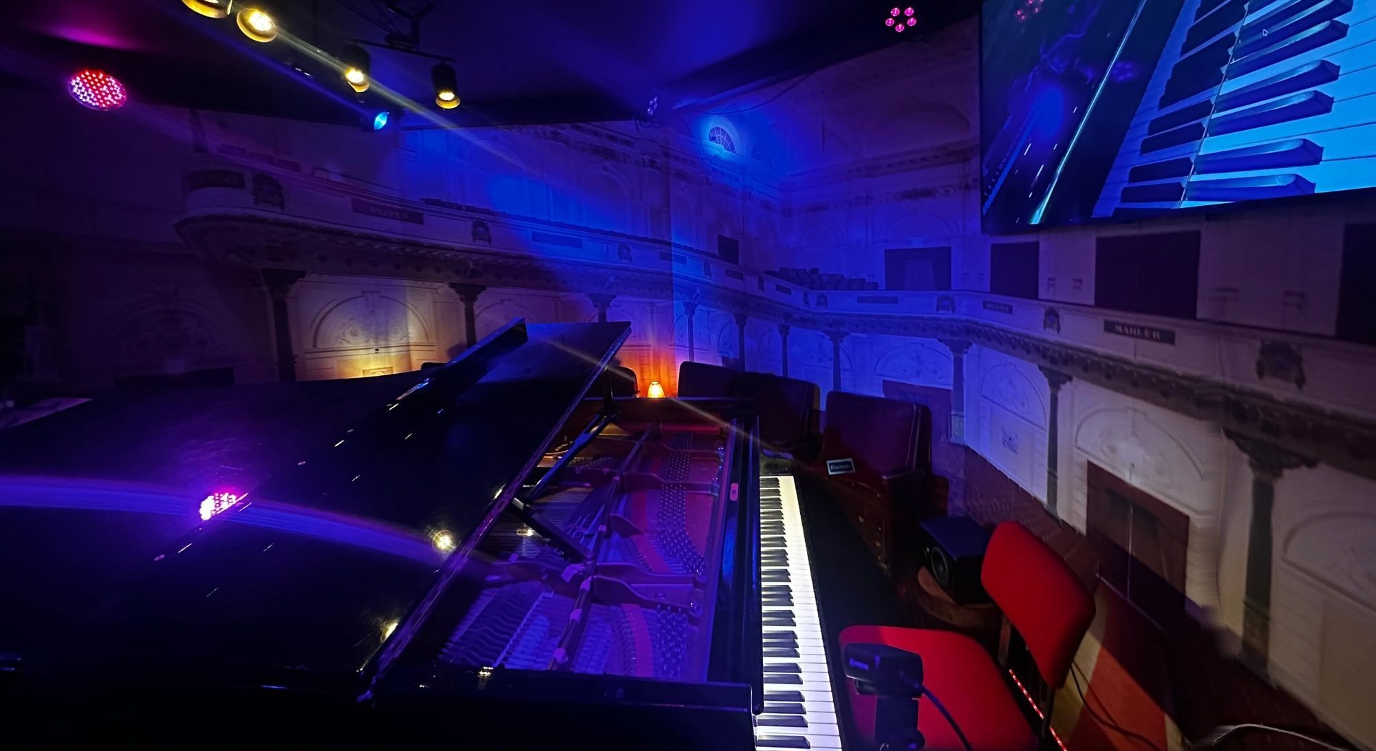 The Velvet Room seen from behind the concert grand, with the seats for the audience